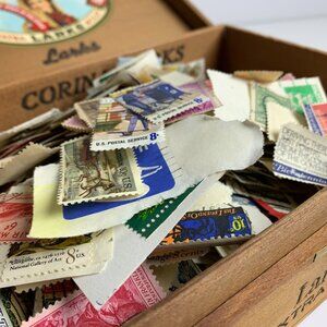 Cigar box full of old stamps